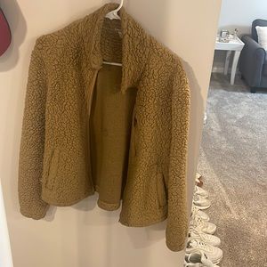 Medium tan fleece jacket from garage.